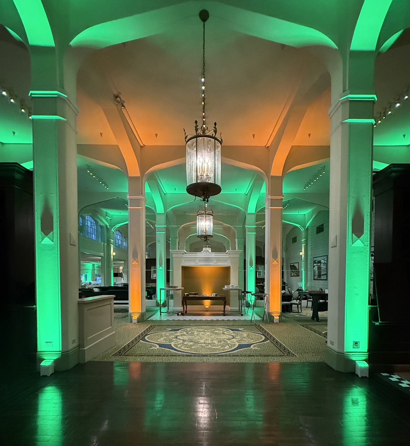 Green architectural uplighting at an event venue